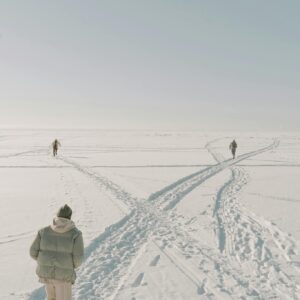 Photo of People Running on the Snow